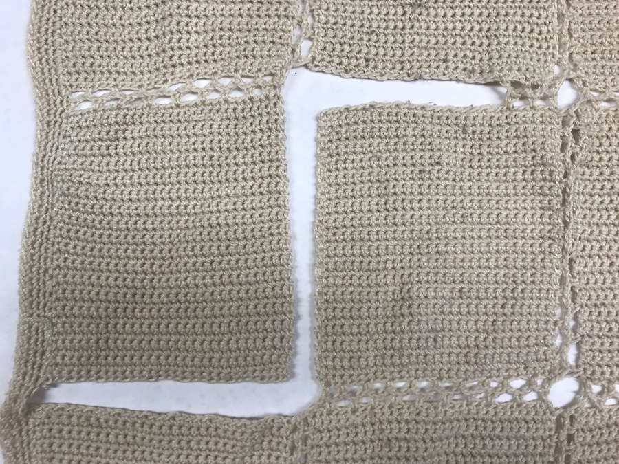 crocheted afghan showing missing chain stitch between blocks